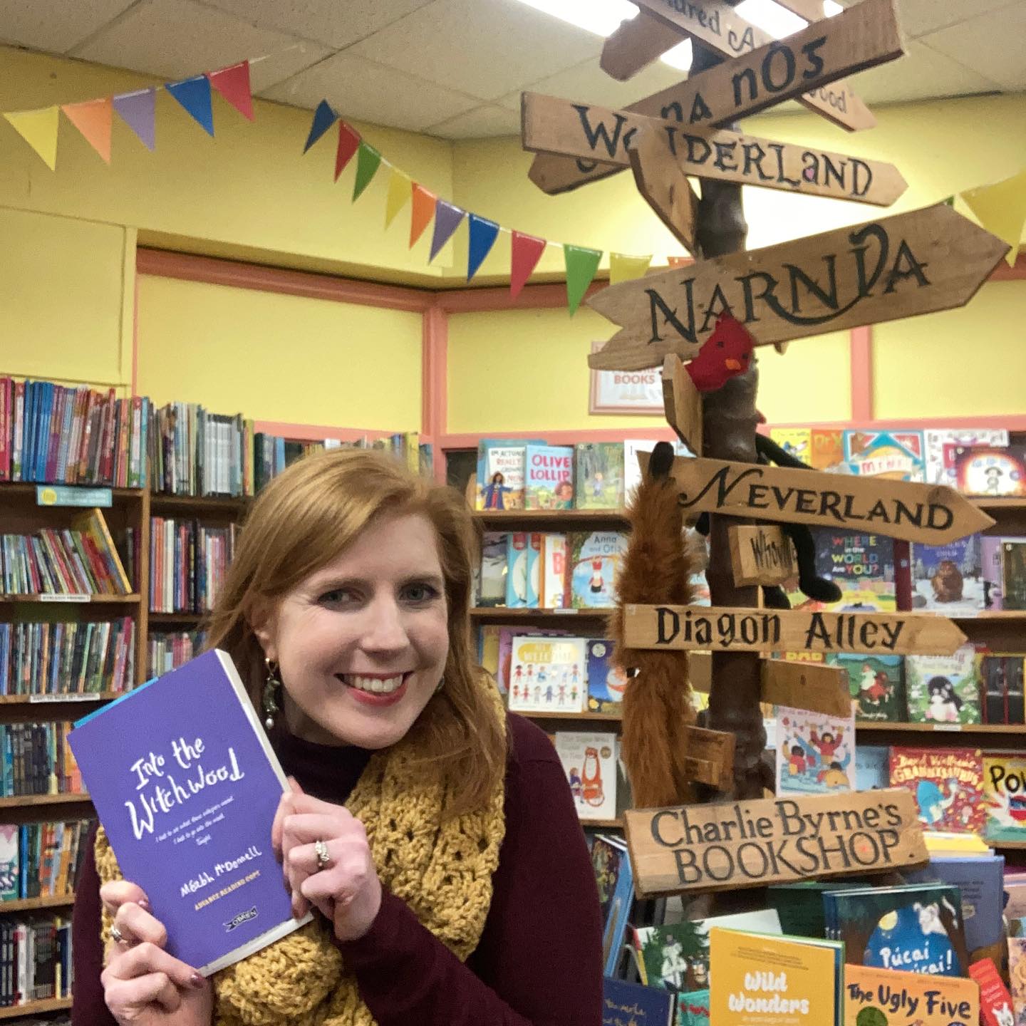 Meabh holding her book in Charlie Byrne's Bookshop