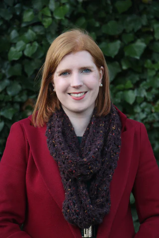 Picutre of Meabh with a red coat